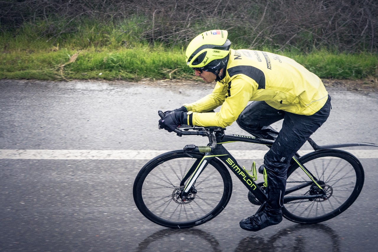 Man riding bicycle on the road wearing gloves